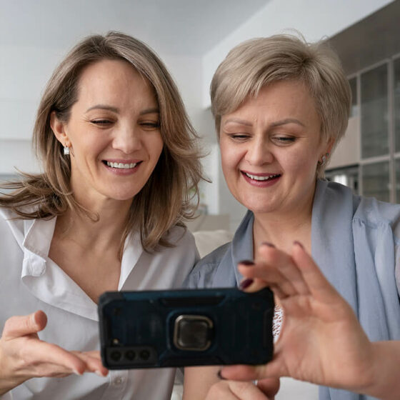 lifestyle image; two women, mobile phone